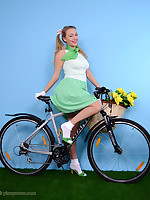Downcast blonde reveals too much on her bike