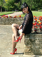 Sexy red heels make this curvy babe in black look fantastic