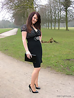 Jenna is looking so good in her black high heels outdoors