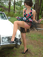 Leggy brunette outdoor in vintage dress and tan stockings