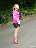 Blonde with an ankle tattoo showing of her pink high heels and sexy nylons