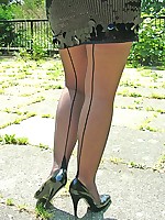 Gorgeous blonde in black high heels and stockings