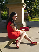 Sexy Tricia takes a stroll gone from wearing a tight red dress with happenstance high heel shoes coupled with handbag
