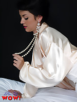 Mysterious brunette Bryoni-Kate Williams at hand satin nightrobe and corset knows how to tease.